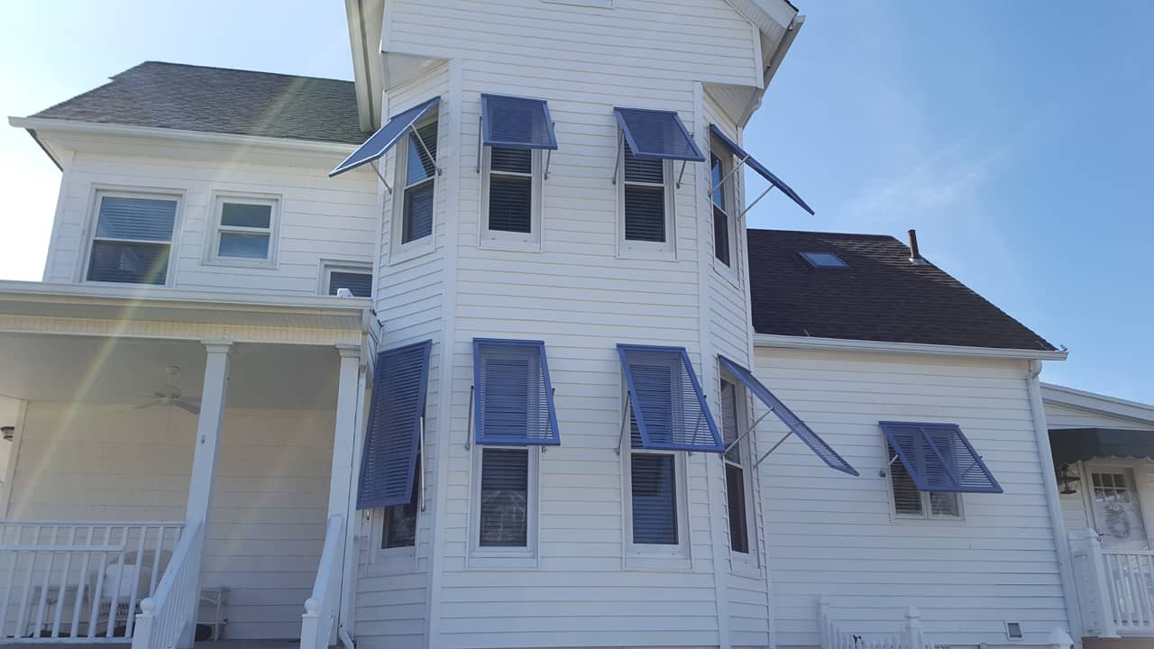 Dark Bahama shutters on a house