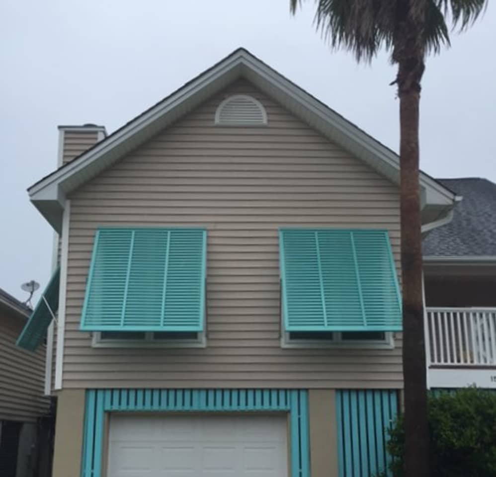 BAHAMA_IMG_0003 Bahama shutters on brick and siding house