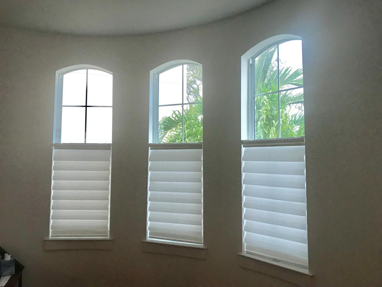 Roman shades on arched windows