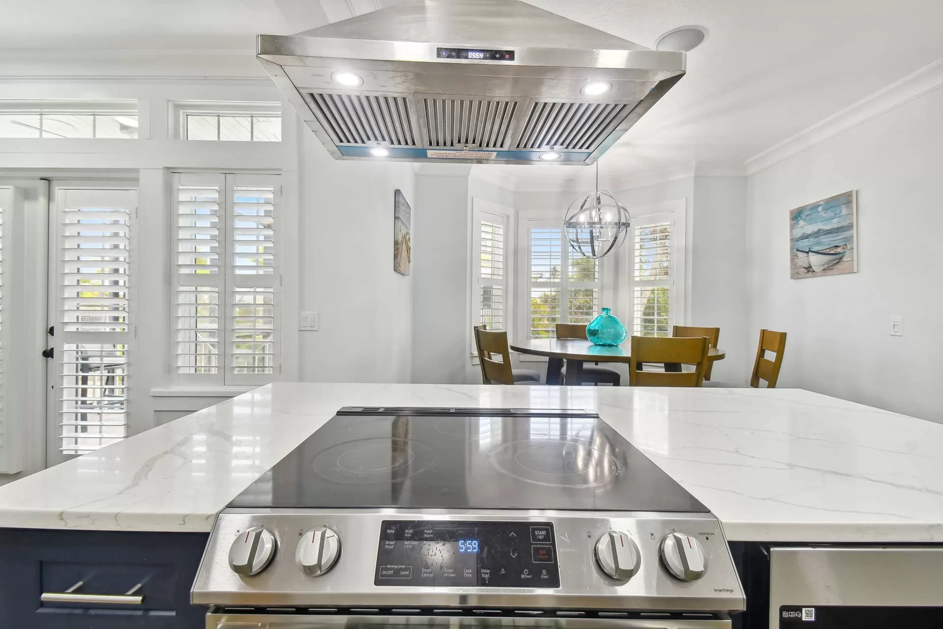 LouverWood Plantation Shutters on French doors in kitchen and dining area LouverWood shutters on French doors and bay windows