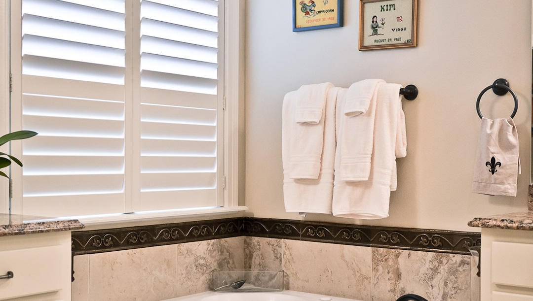 Louverwood-SunroomCorner-Open LouverWood Shutters in Bathroom